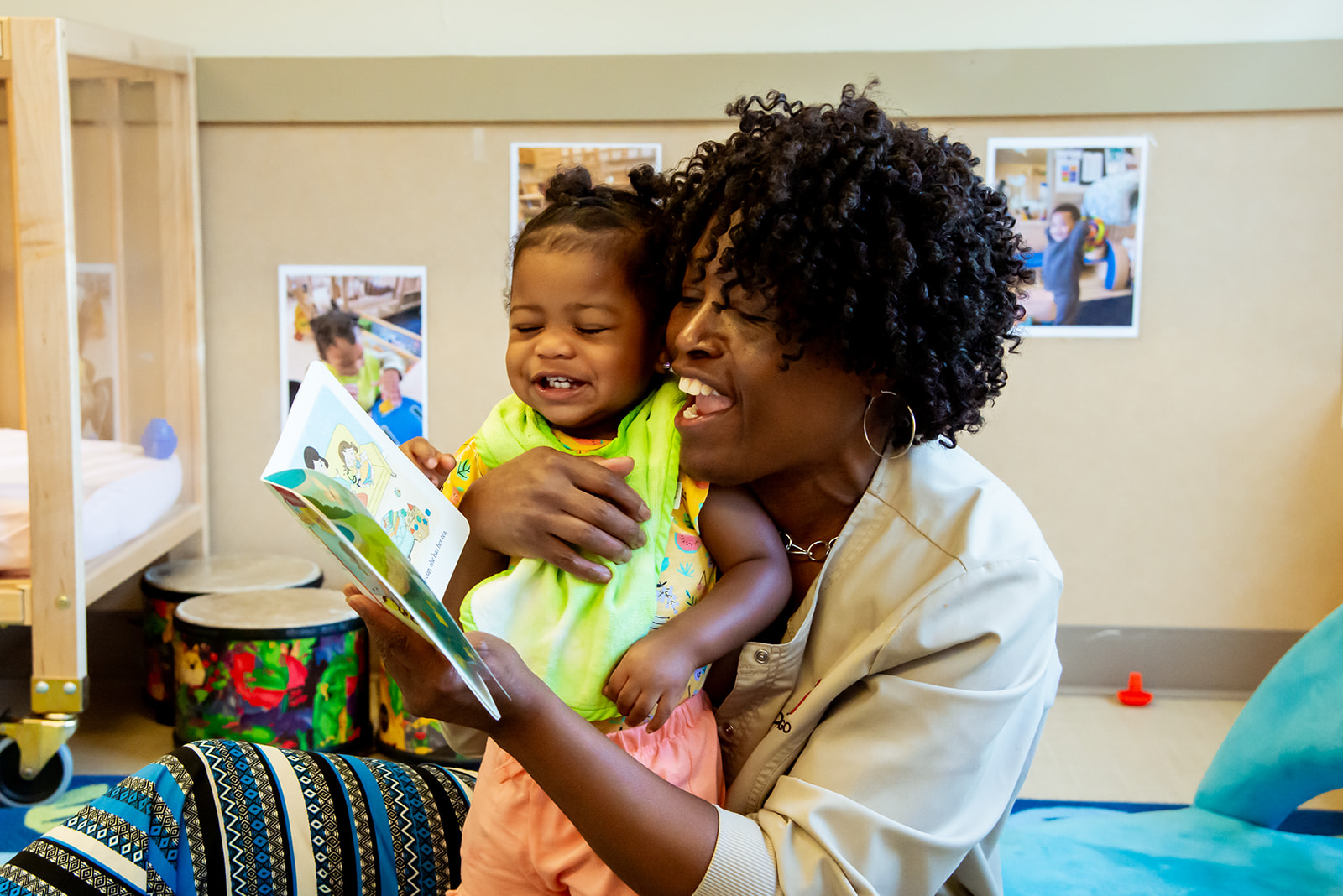 Child and teacher reading together