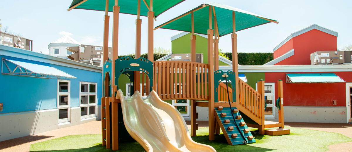 image of playground play structure with focal point being slide