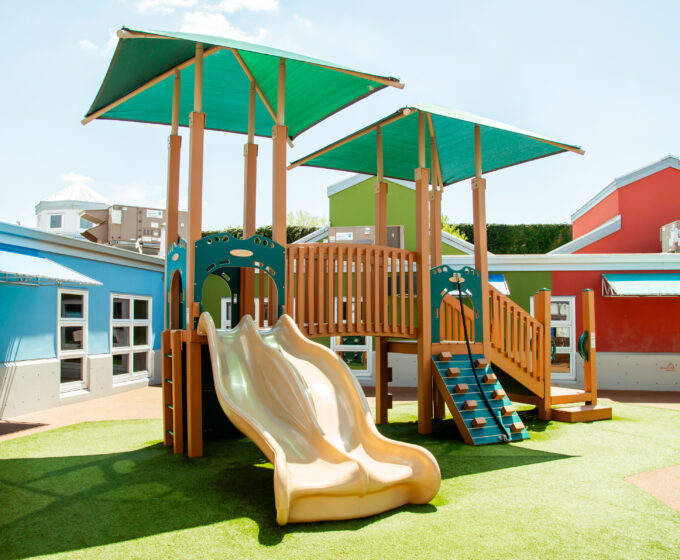 image of playground play structure with focal point being slide